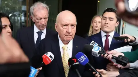 Sex Abuse Charges Against Top Down Under Broadcaster Reduced